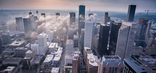white high-rise buildings by Vlad Busuioc courtesy of Unsplash.